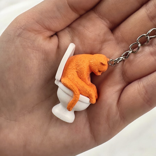 Брелок "Котик на унитазе" оранжевый