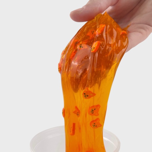 Слайм "Стекло" оранжевый, с дек наполнителем корги 180гр STORIZ